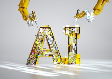 Digital generated image of yellow robotic arms constructing AI sign standing on white ramp.